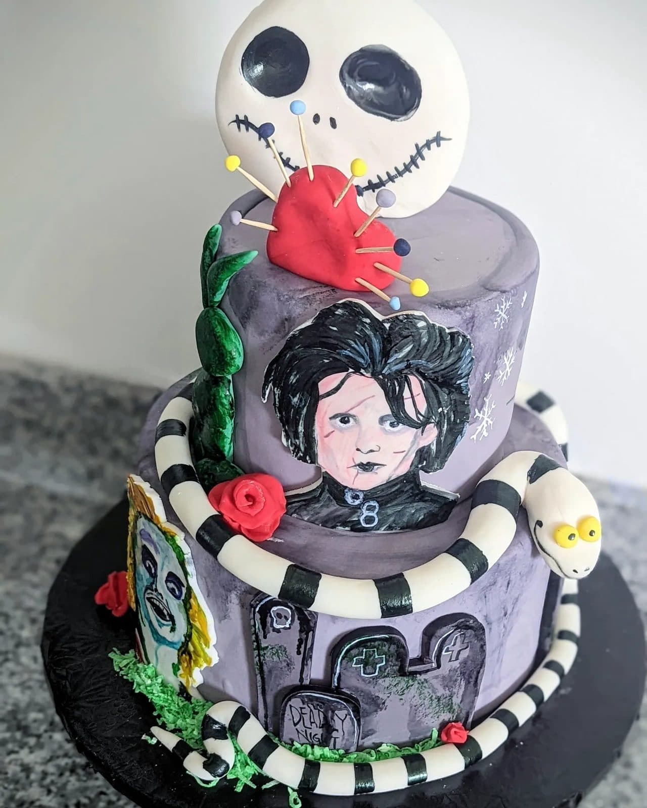 Side of the spooky cake with black-and-white swirls and Happy Birthday written in black.